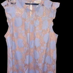 Woman blows e with lace floral pattern